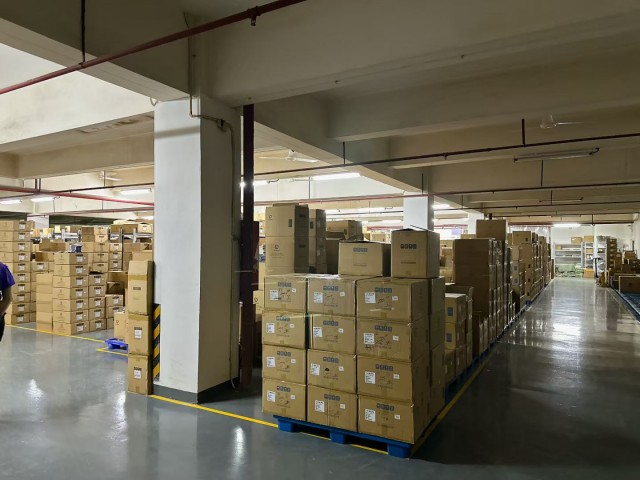 Hands holding a packaged parcel ready for international shipping, illustrating Fita's fast order dispatch and reliable global logistics.