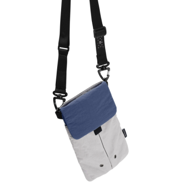 Lightweight nylon crossbody bag in khaki color with three pockets for everyday carry