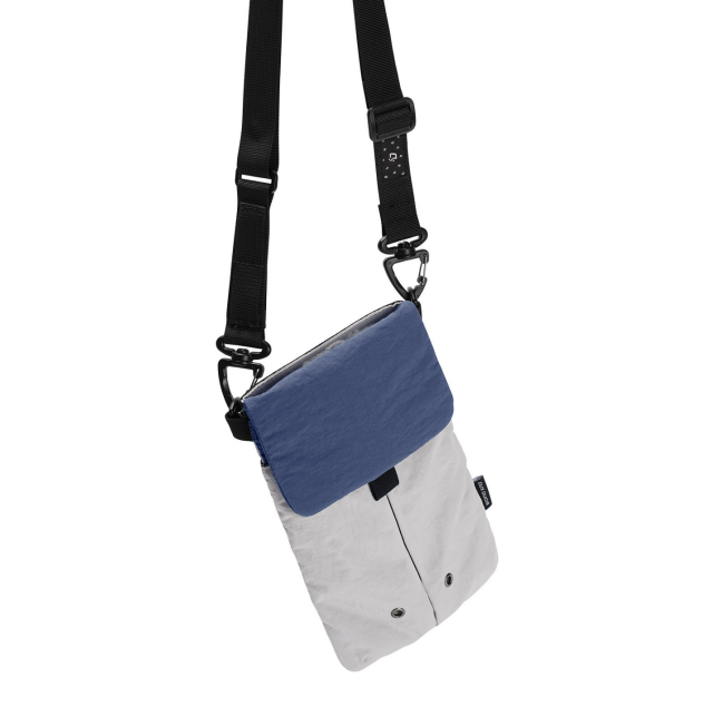 Lightweight nylon crossbody bag in khaki color with three pockets for everyday carry