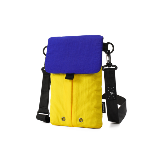 Wholesale color-block mini crossbody bag featuring a royal blue flap, bright yellow body, and adjustable black nylon strap with metal hooks, perfect for B2B fashion boutiques.